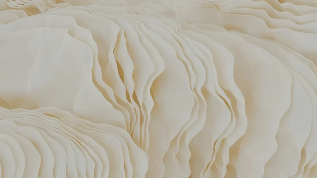 Close-up of white hotel-quality bed sheets with soft texture and natural light